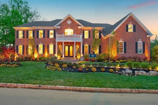 Brick colonial home at twilight